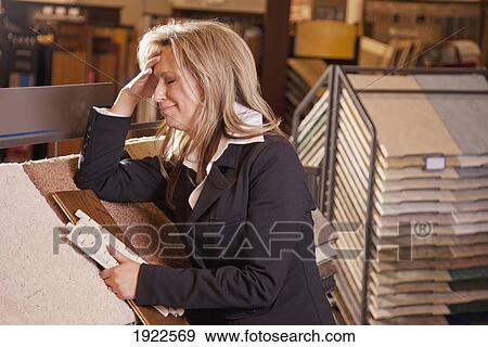 customer choosing floor coverings in a retail flooring store; edmonton, alberta, canada View Large Photo Image Stock Photo - customer choosing floor coverings in a retail flooring store; edmonton, alberta, canada. Fotosearch
