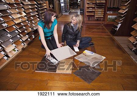 design consultant assisting a customer in a retail flooring store; edmonton, alberta, canada View Large Photo Image Stock Image - design consultant assisting a customer in a retail flooring store; edmonton, alberta, canada. Fotosearch