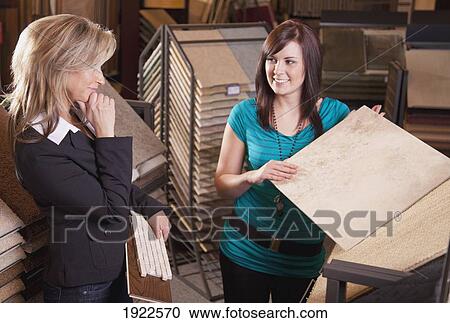 design consultant assisting a customer in a retail flooring store; edmonton, alberta, canada View Large Photo Image Stock Image - design consultant assisting a customer in a retail flooring store; edmonton, alberta, canada. Fotosearch