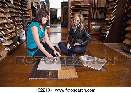 design consultant assisting a customer in a retail flooring store; edmonton, alberta, canada View Large Photo Image Stock Photo - design consultant assisting a customer in a retail flooring store; edmonton, alberta, canada. Fotosearch