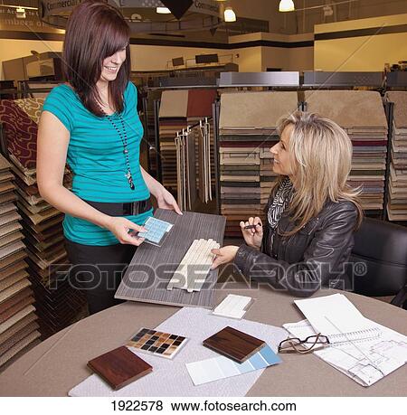 design consultant assisting a customer in a retail flooring store; edmonton, alberta, canada View Large Photo Image Stock Photo - design consultant assisting a customer in a retail flooring store; edmonton, alberta, canada. Fotosearch