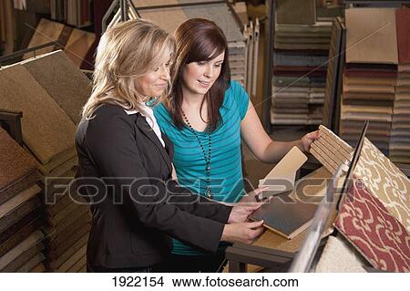 design consultant assisting customer in flooring store; edmonton, alberta, canada View Large Photo Image Picture - design consultant assisting customer in flooring store; edmonton, alberta, canada. Fotosearch