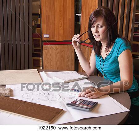 Stock Image - design consultant in retail flooring store; edmonton, alberta, canada. Fotosearch