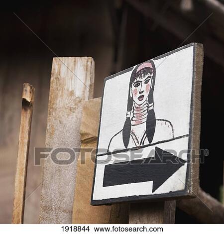 direction sign with drawing of woman; huay pu keng, thailand View Large Photo Image Picture - direction sign with drawing of woman; huay pu keng, thailand. Fotosearch