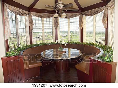 Stock Photo - eating nook in a luxurious house; st. albert, alberta, canada. Fotosearch