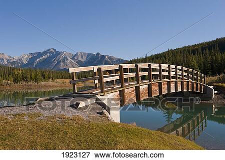 Stock Photo - footbridge at cascade ponds in banff national park; banff, alberta, canada. Fotosearch