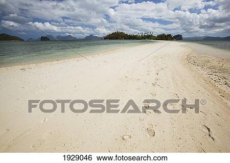 Stock Photograph - footprints in the pure white sands of snake island, near el nido; bacuit archipelago, palawan, philippines. Fotosearch
