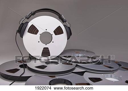 headphones on a reel of recording tape View Large Photo Image Picture - headphones on a reel of recording tape. Fotosearch