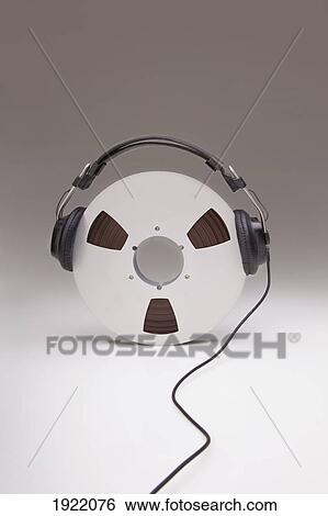 headphones on a reel of recording tape View Large Photo Image Stock Photograph - headphones on a reel of recording tape. Fotosearch