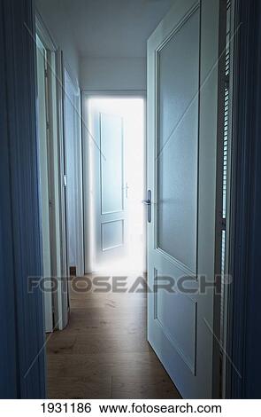 Stock Photograph - light coming from a room at the end of a hallway; tarifa, costa de la luz, cadiz, andalusia, spain. Fotosearch