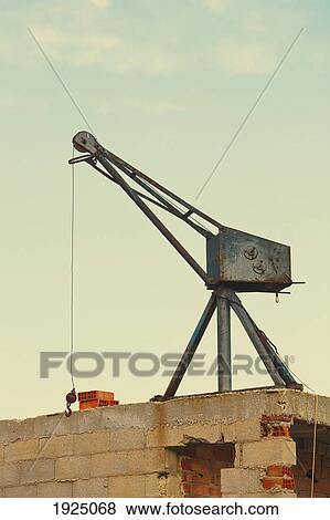 light service crane on roof of unfinished building; torremolinos, malaga province, costa del sol, spain View Large Photo Image Stock Photo - light service crane on roof of unfinished building; torremolinos, malaga province, costa del sol, spain. Fotosearch