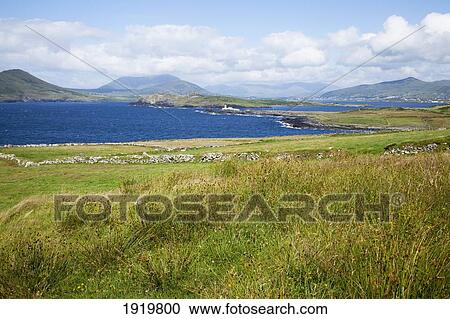 Lighthouse Seen In The Distance; Knightstown, County Kerry, Ireland View Large Photo Image Stock Image - Lighthouse Seen In The Distance; Knightstown, County Kerry, Ireland. Fotosearch