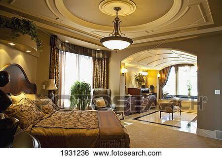 Stock Photograph - luxurious estate home master bedroom and ensuite; st. albert, alberta, canada. Fotosearch