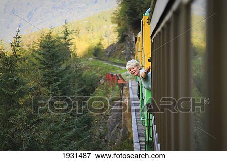 middle-aged woman on white pass & yukon route train; skagway, alaska View Large Photo Image Stock Photo - middle-aged woman on white pass & yukon route train; skagway, alaska. Fotosearch