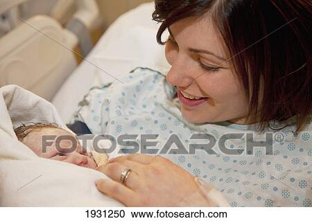 mother holding newborn baby daughter; edmonton, alberta, canada View Large Photo Image Stock Image - mother holding newborn baby daughter; edmonton, alberta, canada. Fotosearch