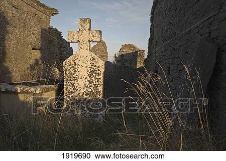 Stock Image - Old Graves In Cemetery; Tullaherin, County Kilkenny, Ireland. Fotosearch