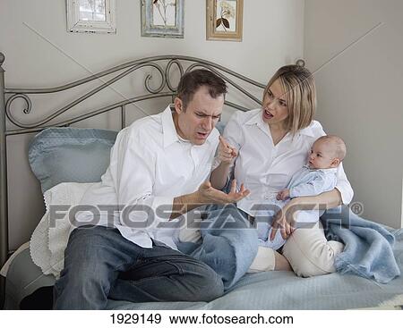 parents argue while holding a baby; jordan, ontario, canada View Large Photo Image Stock Photo - parents argue while holding a baby; jordan, ontario, canada. Fotosearch