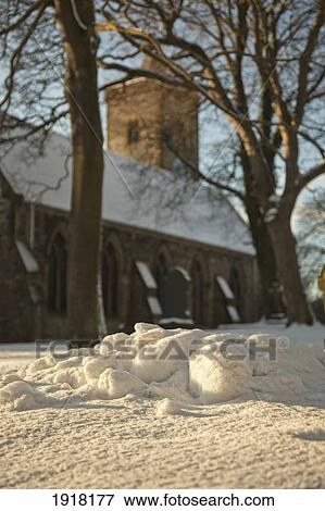 pile of snow outside of church in winter; whitburn, tyne and wear, england View Large Photo Image Stock Photo - pile of snow outside of church in winter; whitburn, tyne and wear, england. Fotosearch
