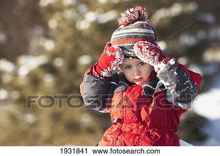 Stock Image - portrait of boy with toque outdoors in winter; thunder bay, ontario, canada. Fotosearch