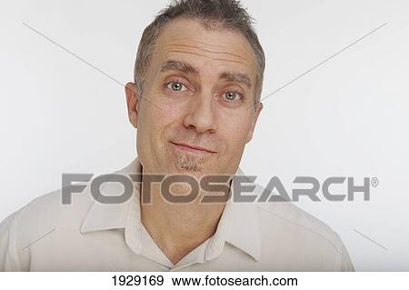 Stock Photo - portrait of man against white background. Fotosearch