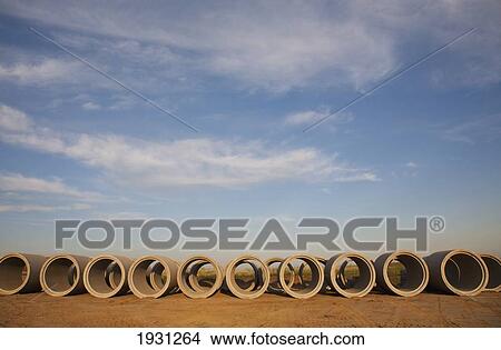 Picture - row of storm sewer pipes; st. albert, alberta, canada. Fotosearch