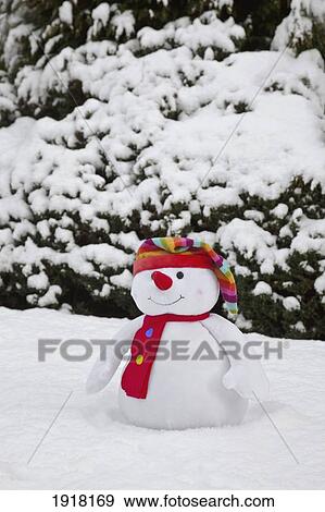 Stock Photo - scarf and winter hat on snowman; whitburn, tyne and wear, england. Fotosearch