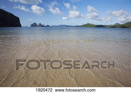 Stock Image - shallow water and sand on an island near el nido; bacuit archipelago, palawan, philippines. Fotosearch
