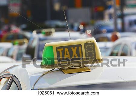 Stock Image - sign on top of a taxi; malaga, andalusia, spain. Fotosearch