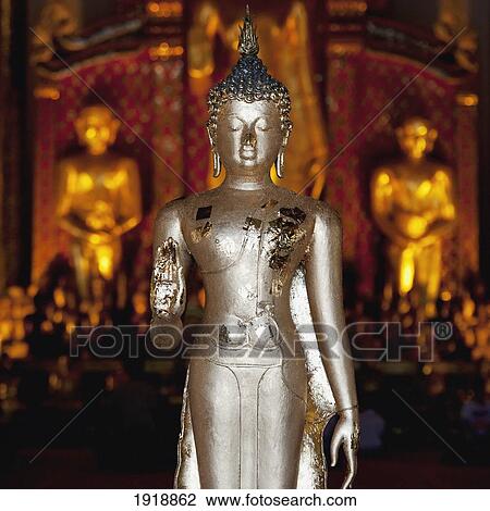 Stock Image - silver statue at wat phra singh temple; chiang mai, thailand. Fotosearch
