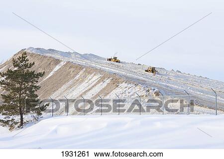 Stock Image - snow storage site; edmonton, alberta, canada. Fotosearch