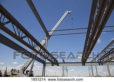 steel structures being moved by a crane in building construction; edmonton, alberta, canada View Large Photo Image Picture - steel structures being moved by a crane in building construction; edmonton, alberta, canada. Fotosearch