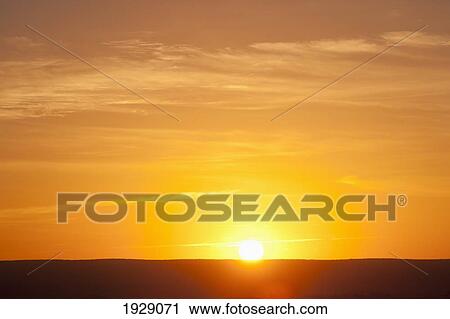 Stock Image - sunrise over level horizon; florida, usa. Fotosearch