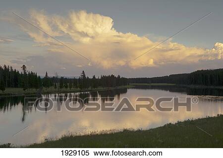 sunset light in storm clouds over the yellowstone river in yelowstone national park; wyoming, united states of america View Large Photo Image Stock Photography - sunset light in storm clouds over the yellowstone river in yelowstone national park; wyoming, united states of america. Fotosearch