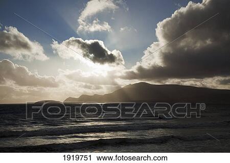 Stock Image - Sunset Over Ocean Horizon; Keel Beach, Achill Island, County Mayo, Ireland. Fotosearch