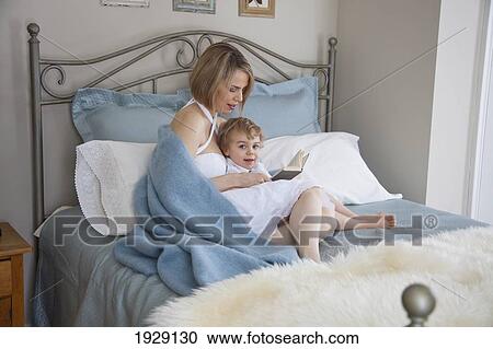 toddler and mother in bed reading; jordan, ontario, canada View Large Photo Image Stock Image - toddler and mother in bed reading; jordan, ontario, canada. Fotosearch