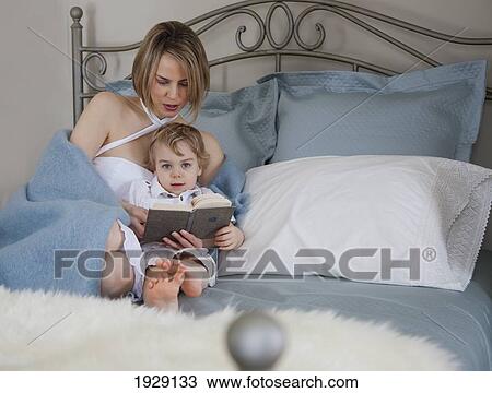toddler and mother in bed reading; jordan, ontario, canada View Large Photo Image Stock Image - toddler and mother in bed reading; jordan, ontario, canada. Fotosearch