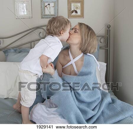 toddler kissing his mother; jordan, ontario, canada View Large Photo Image Stock Image - toddler kissing his mother; jordan, ontario, canada. Fotosearch