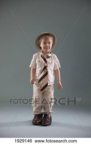 toddler with big shoes and a hat; jordan, ontario, canada View Large Photo Image Stock Photograph - toddler with big shoes and a hat; jordan, ontario, canada. Fotosearch