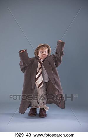 toddler with oversized clothing; jordan, ontario, canada View Large Photo Image Stock Image - toddler with oversized clothing; jordan, ontario, canada. Fotosearch