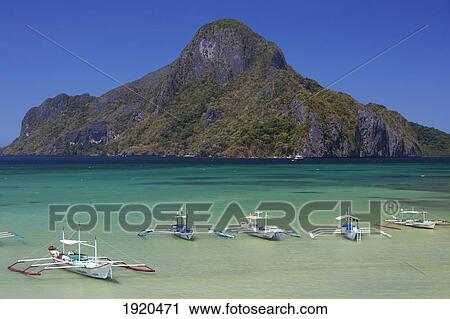traditional bangka boats in the bay near el nido; bacuit archipelago, palawan, philippines View Large Photo Image Stock Image - traditional bangka boats in the bay near el nido; bacuit archipelago, palawan, philippines. Fotosearch