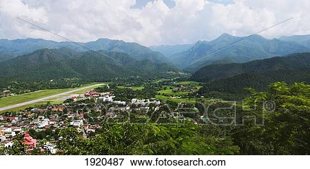 view of a village and mountains; mae hia, chiang mai province, thailand View Large Photo Image Stock Photo - view of a village and mountains; mae hia, chiang mai province, thailand. Fotosearch