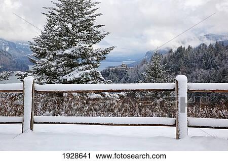 Stock Image - winter snow adds beauty to crown point and vista house from portland women's fourm state park, columbia river gorge national scenic area; oregon, united states of america. Fotosearch