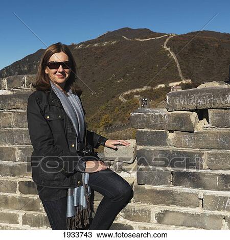 Stock Image - woman on mutianyu section of the great wall of china; beijing, china. Fotosearch
