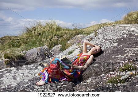 woman relaxing at beach; derrynane beach, county kerry, ireland View Large Photo Image Stock Photo - woman relaxing at beach; derrynane beach, county kerry, ireland. Fotosearch