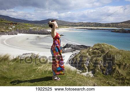woman relaxing at beach; derrynane beach, county kerry, ireland View Large Photo Image Stock Photography - woman relaxing at beach; derrynane beach, county kerry, ireland. Fotosearch