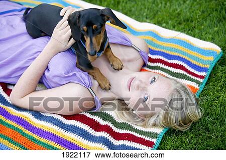 woman relaxing with her miniature dachshund; victoria, vancouver island, british columbia, canada View Large Photo Image Stock Photo - woman relaxing with her miniature dachshund; victoria, vancouver island, british columbia, canada. Fotosearch