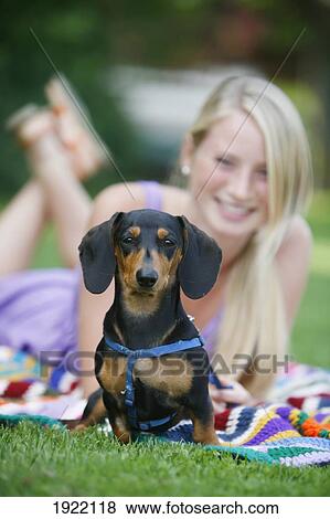 woman relaxing with her miniature dachshund; victoria, vancouver island, british columbia, canada View Large Photo Image Stock Photo - woman relaxing with her miniature dachshund; victoria, vancouver island, british columbia, canada. Fotosearch