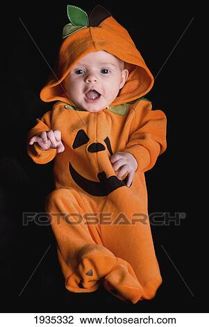 A Baby Wearing An Orange Pumpkin Costume; Alberta, Canada View Large Photo Image Stock Image - A Baby Wearing An Orange Pumpkin Costume; Alberta, Canada. Fotosearch