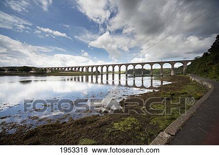 Stock Photo - a bridge going across the water; berwick northumberland england. Fotosearch