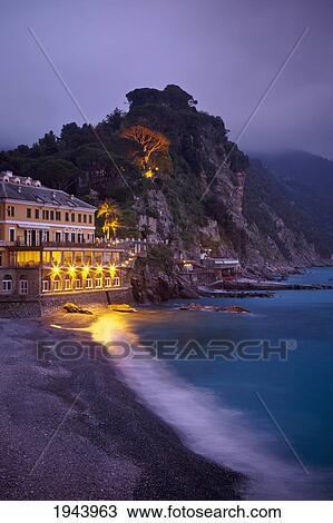 A Building Illuminated At Night Along The Coast; Camogli Liguria Italy View Large Photo Image Stock Image - A Building Illuminated At Night Along The Coast; Camogli Liguria Italy. Fotosearch